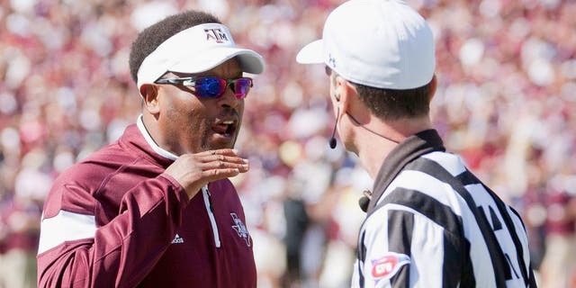 Oct 4, 2014; Starkville, MS, USA; Texas A&M Aggies head coach Kevin Sumlin discusses a play with an official during the game against the Mississippi State Bulldogs at Davis Wade Stadium. Mandatory Credit: Marvin Gentry-USA TODAY Sports