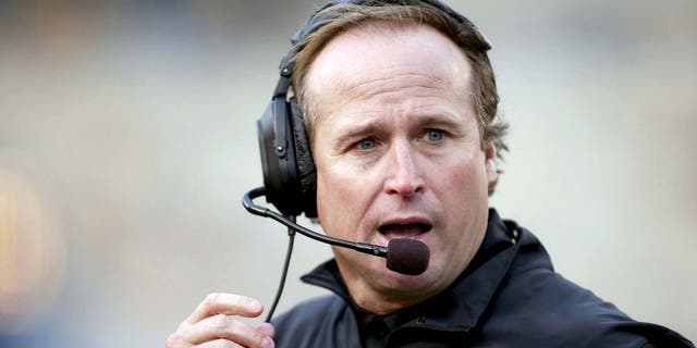 Oct 4, 2014; Morgantown, WV, USA; West Virginia Mountaineers head coach Dana Holgorsen reacts on the sidelines against the Kansas Jayhawks during the third quarter at Milan Puskar Stadium. The Mountaineers won 33-14. Mandatory Credit: Charles LeClaire-USA TODAY Sports