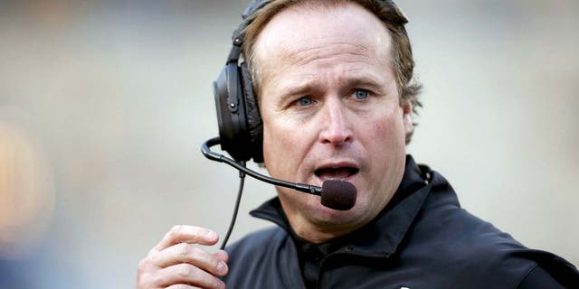 Oct 4, 2014; Morgantown, WV, USA; West Virginia Mountaineers head coach Dana Holgorsen reacts on the sidelines against the Kansas Jayhawks during the third quarter at Milan Puskar Stadium. The Mountaineers won 33-14. Mandatory Credit: Charles LeClaire-USA TODAY Sports