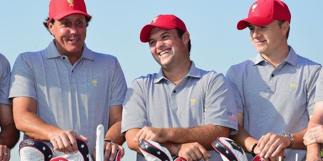 INCHEON CITY, SOUTH KOREA - OCTOBER 06: (L-R) Phil Mickelson, Patrick Reed and Jordan Spieth of the United States team pose with the team during a photocall on the practice ground prior to the start of The Presidents Cup at the Jack Nicklaus Golf Club on October 6, 2015 in Incheon City, South Korea. (Photo by Harry How/Getty Images)