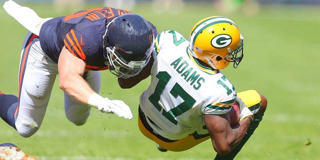 Sep 13, 2015; Chicago, IL, USA; Green Bay Packers wide receiver Davante Adams (17) is tackled by Chicago Bears outside linebacker Shea McClellin (50) during the second quarter at Soldier Field. Mandatory Credit: Dennis Wierzbicki-USA TODAY Sports
