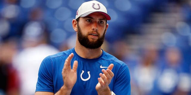 Oct 4, 2015; Indianapolis, IN, USA; Indianapolis Colts quarterback Andrew Luck (12) watches the Colts warm up before the game against the Jacksonville Jaguars at Lucas Oil Stadium. Mandatory Credit: Brian Spurlock-USA TODAY Sports