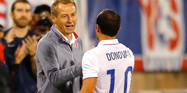 EAST HARTFORD, CT- OCTOBER 10: Landon Donovan #10 of the United States shakes hands head coach Jurgen Klinsmann as he leaves the field after playing in the first half during an international friendly with Ecuador at Rentschler Field on October 10, 2014 in East Hartford, Connecticut. (Photo by Jim Rogash/Getty Images)
