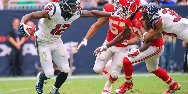 Sep 13, 2015; Houston, TX, USA; Houston Texans wide receiver Keith Mumphery (12) stiff arms Kansas City Chiefs wide receiver Chris Conley (17) during the game at NRG Stadium. Mandatory Credit: Kevin Jairaj-USA TODAY Sports