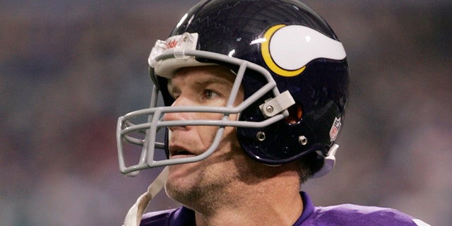 Sept. 19: Minnesota Vikings quarterback Brett Favre is shown walking to the sideline after throwing an interception during the Vikings and Miami Dolphins NFL football game, in Minneapolis.