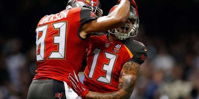 NEW ORLEANS, LA - SEPTEMBER 20: Mike Evans #13 celebrates with Vincent Jackson #83 of the Tampa Bay Buccaneers following his touchdown reception during the second quarter of a game against the New Orleans Saints at the Mercedes-Benz Superdome on September 20, 2015 in New Orleans, Louisiana. (Photo by Wesley Hitt/Getty Images)
