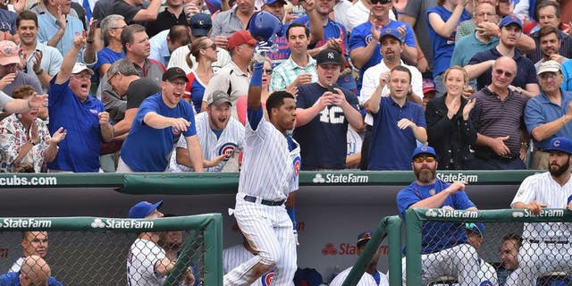 Sep 19, 2015; Chicago, IL, USA; Chicago Cubs shortstop Starlin Castro (13) waives to the fans after hitting his second home run of the game against the St. Louis Cardinals at Wrigley Field. Mandatory Credit: Jasen Vinlove-USA TODAY Sports