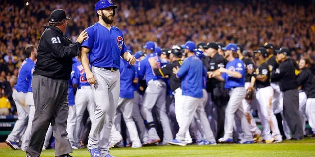 PITTSBURGH, PA - OCTOBER 07: Jake Arrieta #49 of the Chicago Cubs walks off the field with umpire Hunter Wendelstedt #21 after being hit by a pitch thrown by Tony Watson #44 of the Pittsburgh Pirates (not pictured) in the seventh inning during the National League Wild Card game between the Pittsburgh Pirates and the Chicago Cubs at PNC Park on October 7, 2015 in Pittsburgh, Pennsylvania. (Photo by Jared Wickerham/Getty Images)