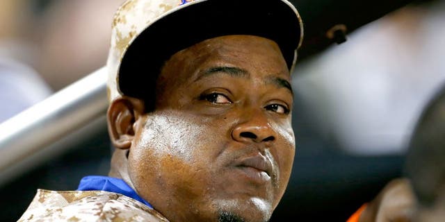 NEW YORK, NY - AUGUST 31: Juan Uribe #2 of the New York Mets looks on from the dugout against the Philadelphia Phillies on August 31, 2015 at Citi Field in the Flushing neighborhood of the Queens borough of New York City. (Photo by Rich Schultz/Getty Images)