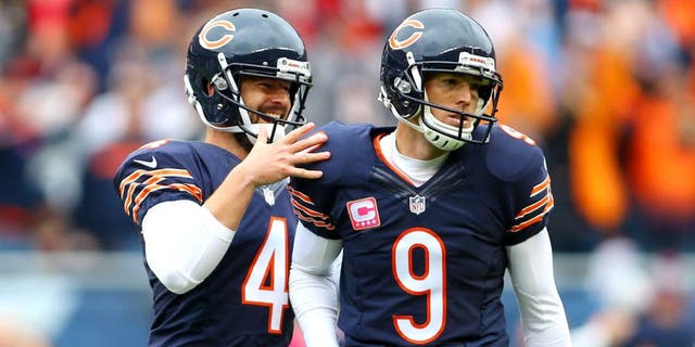 Oct 4, 2015; Chicago, IL, USA; Chicago Bears kicker Robbie Gould (9) celebrates with punter Spencer Lanning (4) ater kicking the winning field goal against the Oakland Raiders in the fourth quarter at Soldier Field. Mandatory Credit: Jerry Lai-USA TODAY Sports