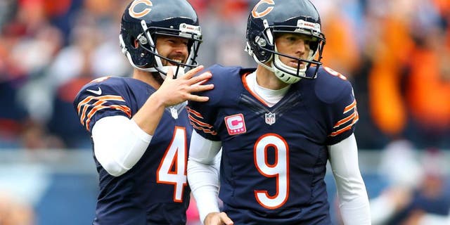 Oct 4, 2015; Chicago, IL, USA; Chicago Bears kicker Robbie Gould (9) celebrates with punter Spencer Lanning (4) ater kicking the winning field goal against the Oakland Raiders in the fourth quarter at Soldier Field. Mandatory Credit: Jerry Lai-USA TODAY Sports