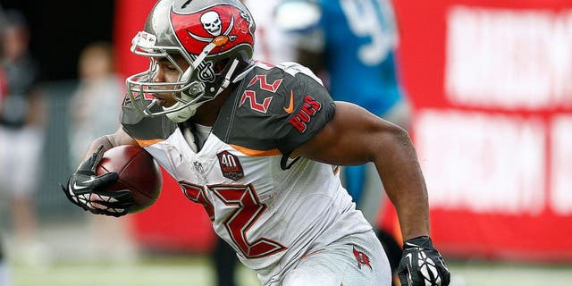 Oct 4, 2015; Tampa, FL, USA; Tampa Bay Buccaneers running back Doug Martin (22) runs for a first down during the fourth quarter of an NFL football game against the Carolina Panthers at Raymond James Stadium. Carolina won 37-23. Mandatory Credit: Reinhold Matay-USA TODAY Sports