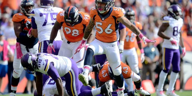 Oct 4, 2015; Denver, CO, USA; Denver Broncos linebacker Shane Ray (56) celebrates his sack in the first quarter against the Minnesota Vikings at Sports Authority Field at Mile High. Mandatory Credit: Ron Chenoy-USA TODAY Sports