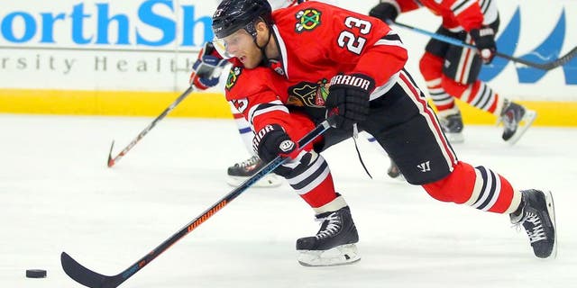 Oct 1, 2014; Chicago, IL, USA; Chicago Blackhawks right wing Kris Versteeg (23) with the puck during the second period against the Montreal Canadiens at the United Center. Mandatory Credit: Dennis Wierzbicki-USA TODAY Sports
