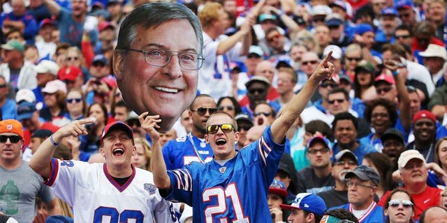 ORCHARD PARK, NY - SEPTEMBER 14: Buffalo Bills fans hold up a picture of Terry Pegula during the first half against the Miami Dolphins at Ralph Wilson Stadium on September 14, 2014 in Orchard Park, New York. (Photo by Tom Szczerbowski/Getty Images)