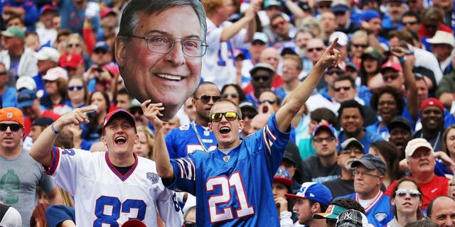 ORCHARD PARK, NY - SEPTEMBER 14: Buffalo Bills fans hold up a picture of Terry Pegula during the first half against the Miami Dolphins at Ralph Wilson Stadium on September 14, 2014 in Orchard Park, New York. (Photo by Tom Szczerbowski/Getty Images)