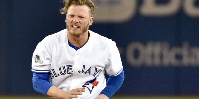 Oct 8, 2015; Toronto, Ontario, CAN; Toronto Blue Jays third baseman Josh Donaldson reacts after being forced out at second base by the Texas Rangers in the fourth inning in game one of the ALDS at Rogers Centre. Mandatory Credit: Nick Turchiaro-USA TODAY Sports