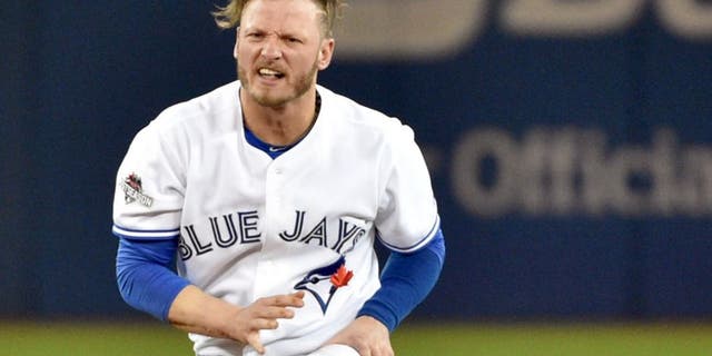 Oct 8, 2015; Toronto, Ontario, CAN; Toronto Blue Jays third baseman Josh Donaldson reacts after being forced out at second base by the Texas Rangers in the fourth inning in game one of the ALDS at Rogers Centre. Mandatory Credit: Nick Turchiaro-USA TODAY Sports