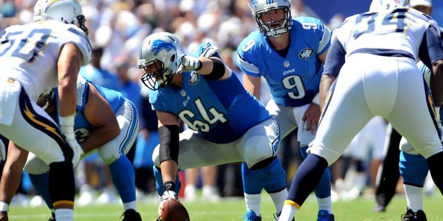 Sep 13, 2015; San Diego, CA, USA; Detroit Lions center Travis Swanson (64) points out a defensive player during the game against the San Diego Chargers at Qualcomm Stadium. San Diego won 33-28. Mandatory Credit: Orlando Ramirez-USA TODAY Sports