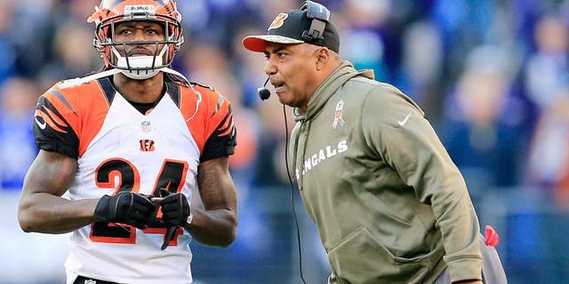 BALTIMORE, MD - NOVEMBER 10: Head coach Marvin Lewis of the Cincinnati Bengals talks with Adam Jones #24 during the fourth quarter against the Baltimore Ravens at M&T Bank Stadium on November 10, 2013 in Baltimore, Maryland. (Photo by Rob Carr/Getty Images) *** Local Caption *** Marvin Lewis; Adam Jones