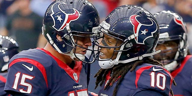HOUSTON, TX - SEPTEMBER 27: Ryan Mallett #15 of the Houston Texans and DeAndre Hopkins #10 celebrate after a touchdown in the first quarter at NRG Stadium on September 27, 2015 in Houston, Texas. (Photo by Bob Levey/Getty Images)