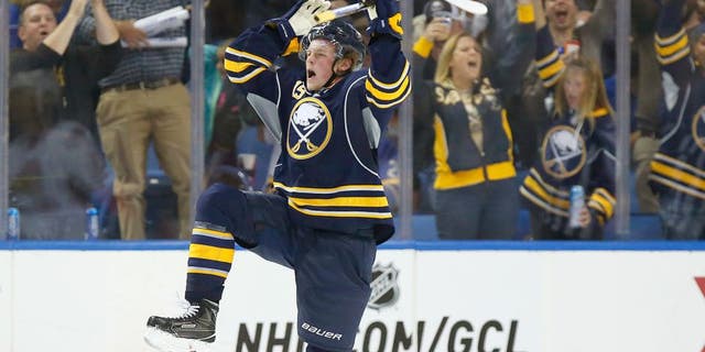 Oct 8, 2015; Buffalo, NY, USA; Buffalo Sabres center Jack Eichel (15) celebrates after scoring his first NHL goal during the third period against the Ottawa Senators at First Niagara Center. Senators beat the Sabres 3-1. Mandatory Credit: Kevin Hoffman-USA TODAY Sports