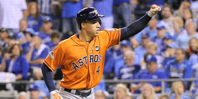George Springer #4 of the Houston Astros celebrates after hitting a solo home run in the fifth inning against the Kansas City Royals during game one of the American League Division Series at Kauffman Stadium on October 8, 2015 in Kansas City, Missouri. (Photo by Ed Zurga/Getty Images)