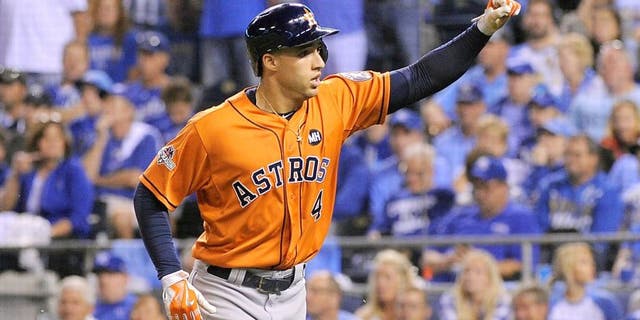 George Springer #4 of the Houston Astros celebrates after hitting a solo home run in the fifth inning against the Kansas City Royals during game one of the American League Division Series at Kauffman Stadium on October 8, 2015 in Kansas City, Missouri. (Photo by Ed Zurga/Getty Images)
