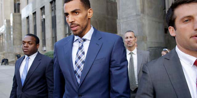 Oct. 7, 2015: Thabo Sefolosha, second from left, leaves criminal court in New York. (Associated Press)