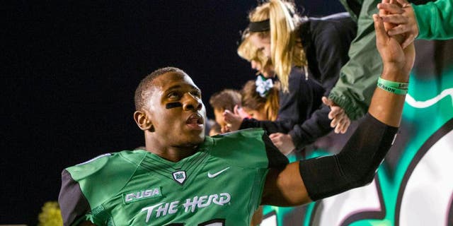 Oct 9, 2015; Huntington, WV, USA; Marshall Thundering Herd defensive back Rodney Allen (11) celebrates beating Southern Miss Golden Eagles at the end of the game at Joan C. Edwards Stadium. Marshall won the game 31-10. Mandatory Credit: Ben Queen-USA TODAY Sports