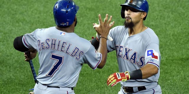 Oct 8, 2015; Toronto, Ontario, CAN; Texas Rangers second baseman Rougned Odor (right) celebrates with center fielder Delino DeShields (7) after hitting a solo home run against the Toronto Blue Jays in the 7th inning in game one of the ALDS at Rogers Centre. Mandatory Credit: Dan Hamilton-USA TODAY Sports