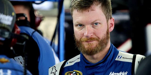 CHARLOTTE, NC - OCTOBER 08: Dale Earnhardt Jr., driver of the #88 Nationwide Chevrolet, stands in the garage during practice for the NASCAR Sprint Cup Series Bank of America 500 at Charlotte Motor Speedway on October 8, 2015 in Charlotte, North Carolina. (Photo by Jerry Markland/Getty Images)