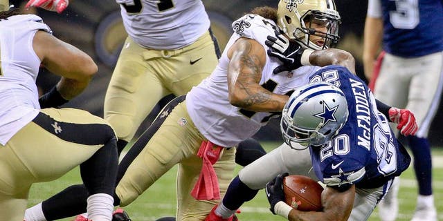 Oct 4, 2015; New Orleans, LA, USA; New Orleans Saints outside linebacker Hau'oli Kikaha (44) tackles Dallas Cowboys running back Darren McFadden (20) during the second half at the Mercedes-Benz Superdome. The Saints won 26-20 in overtime. Mandatory Credit: Derick E. Hingle-USA TODAY Sports