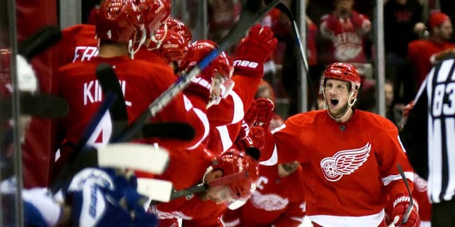Oct 9, 2015; Detroit, MI, USA; Detroit Red Wings left wing Justin Abdelkader (8) celebrates his goal and hat trick during the second period against the Toronto Maple Leafs at Joe Louis Arena. Mandatory Credit: Tim Fuller-USA TODAY Sports
