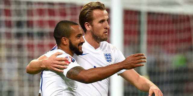 LONDON, ENGLAND - OCTOBER 09: Theo Walcott and Harry Kane of England celebrate after scoring the opening goal during the UEFA EURO 2016 Group E Qualifier match between England and Estonia at Wembley Stadium on October 9, 2015 in London, United Kingdom. (Photo by Michael Regan - The FA/The FA via Getty Images)