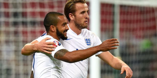 LONDON, ENGLAND - OCTOBER 09: Theo Walcott and Harry Kane of England celebrate after scoring the opening goal during the UEFA EURO 2016 Group E Qualifier match between England and Estonia at Wembley Stadium on October 9, 2015 in London, United Kingdom. (Photo by Michael Regan - The FA/The FA via Getty Images)