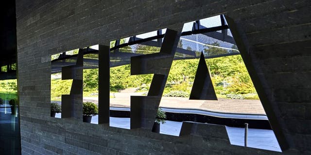 FIFA employees enter at the FIFA headquarters on June 3, 2015 in Zurich. Blatter resigned on June 2, 2015 as president of FIFA as a mounting corruption scandal engulfed world football's governing body. The 79-year-old Swiss official, FIFA president for 17 years and only reelected on May 29, said a special congress would be called as soon as possible to elect a successor. AFP PHOTO / MICHAEL BUHOLZER (Photo credit should read MICHAEL BUHOLZER/AFP/Getty Images)