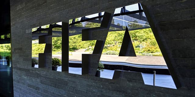 FIFA employees enter at the FIFA headquarters on June 3, 2015 in Zurich. Blatter resigned on June 2, 2015 as president of FIFA as a mounting corruption scandal engulfed world football's governing body. The 79-year-old Swiss official, FIFA president for 17 years and only reelected on May 29, said a special congress would be called as soon as possible to elect a successor. AFP PHOTO / MICHAEL BUHOLZER (Photo credit should read MICHAEL BUHOLZER/AFP/Getty Images)