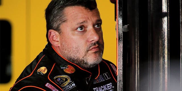 CHARLOTTE, NC - OCTOBER 08: Tony Stewart, driver of the #14 Bass Pro Shops/Mobil 1 Chevrolet, stis in the garage during practice for the NASCAR Sprint Cup Series Bank of America 500 at Charlotte Motor Speedway on October 8, 2015 in Charlotte, North Carolina. (Photo by Jerry Markland/Getty Images)