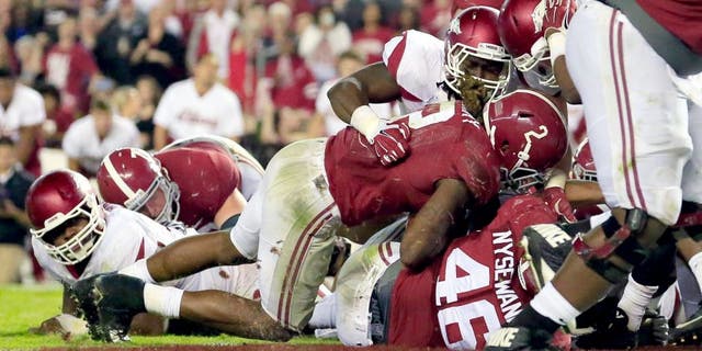Oct 10, 2015; Tuscaloosa, AL, USA; Alabama Crimson Tide running back Derrick Henry (2) scores a touchdown during the fourth quarter against Arkansas Razorbacks at Bryant-Denny Stadium. Alabama defeated Arkansas 27-14. Mandatory Credit: Marvin Gentry-USA TODAY Sports