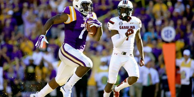 Oct 10, 2015; Baton Rouge, LA, USA; LSU Tigers running back Leonard Fournette (7) runs for an 87-yard touchdown during the third quarter of a game against the South Carolina Gamecocks at Tiger Stadium. Mandatory Credit: Derick E. Hingle-USA TODAY Sports