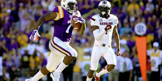 Oct 10, 2015; Baton Rouge, LA, USA; LSU Tigers running back Leonard Fournette (7) runs for an 87-yard touchdown during the third quarter of a game against the South Carolina Gamecocks at Tiger Stadium. Mandatory Credit: Derick E. Hingle-USA TODAY Sports