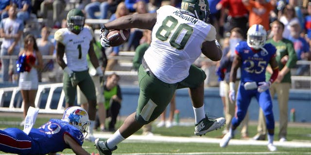 Oct 10, 2015; Lawrence, KS, USA; BBaylor Bears tight end LaQuan McGowan (80) scores a touchdown after catching a pass against Kansas Jayhawks safety Michael Glatczak (39) in the first half at Memorial Stadium. Mandatory Credit: John Rieger-USA TODAY Sports