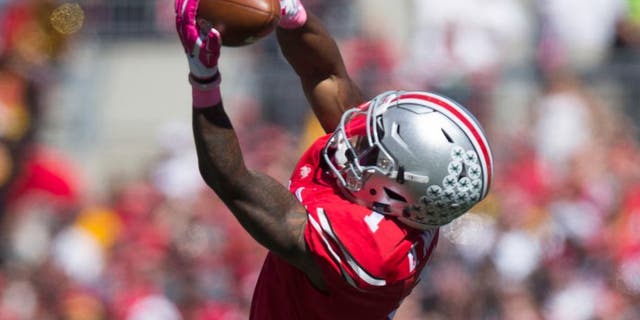 Oct 10, 2015; Columbus, OH, USA; Ohio State Buckeyes wide receiver Braxton Miller (1) makes a catch across the middle against the Maryland Terrapins at Ohio Stadium. Mandatory Credit: Greg Bartram-USA TODAY Sports