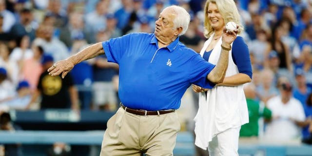 Los Angeles Dodgers legend Tommy Lasorda throws out the ceremonial first pitch before the Dodgers take on the New York Mets in game two of the National League Division Series at Dodger Stadium on Oct. 10, 2015, in Los Angeles. (Sean M. Haffey/Getty Images)