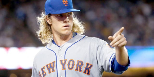 LOS ANGELES, CA - OCTOBER 10: Noah Syndergaard #34 of the New York Mets reacts after recording the final out of the second inning against the Los Angeles Dodgers in game two of the National League Division Series at Dodger Stadium on October 10, 2015 in Los Angeles, California. (Photo by Sean M. Haffey/Getty Images)