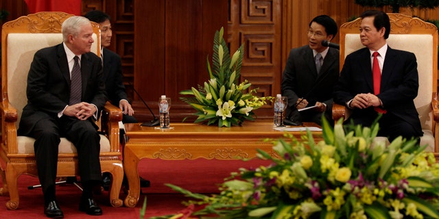 Oct. 11: Defense Secretary Robert Gates, left, meets with Vietnam's Prime Minister Nguyen Tan Dung in a meeting room at the Prime Minister's office in Hanoi, Vietnam.