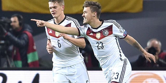 LEIPZIG, GERMANY - OCTOBER 11: Max Kruse of Germany (23) celebrates with team mate Matthias Ginter as he scores their second goal during the UEFA EURO 2016 Group D qualifying match between Germany and Georgia at Stadium Leipzig on October 11, 2015 in Leipzig, Germany. (Photo by Dennis Grombkowski/Bongarts/Getty Images)