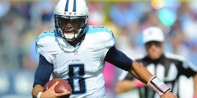 Oct 11, 2015; Nashville, TN, USA; Tennessee Titans quarterback Marcus Mariota (8) runs for a short gain during the first half against the Buffalo Bills at Nissan Stadium. Mandatory Credit: Christopher Hanewinckel-USA TODAY Sports