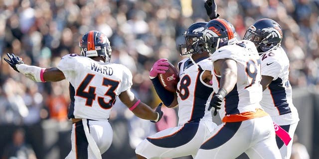 OAKLAND, CA - OCTOBER 11: Von Miller #58 of the Denver Broncos celebrates in the third quarter with teammates T.J. Ward #43 of the Denver Broncos, Malik Jackson #97 of the Denver Broncos and Darian Stewart #26 of the Denver Broncos against the Oakland Raiders at O.co Coliseum on October 11, 2015 in Oakland, California. (Photo by Ezra Shaw/Getty Images)